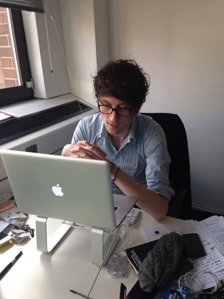Working at a laptop in the Harkable office