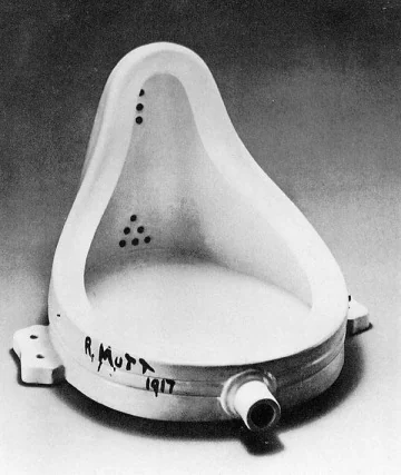 Black-and-white photograph of a signed urinal presented as an artwork.
