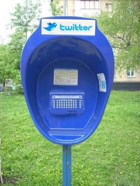 Blue public terminal bearing a Twitter sign.