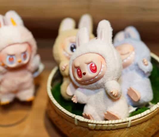 Four Labubu soft toys in a close-up photo