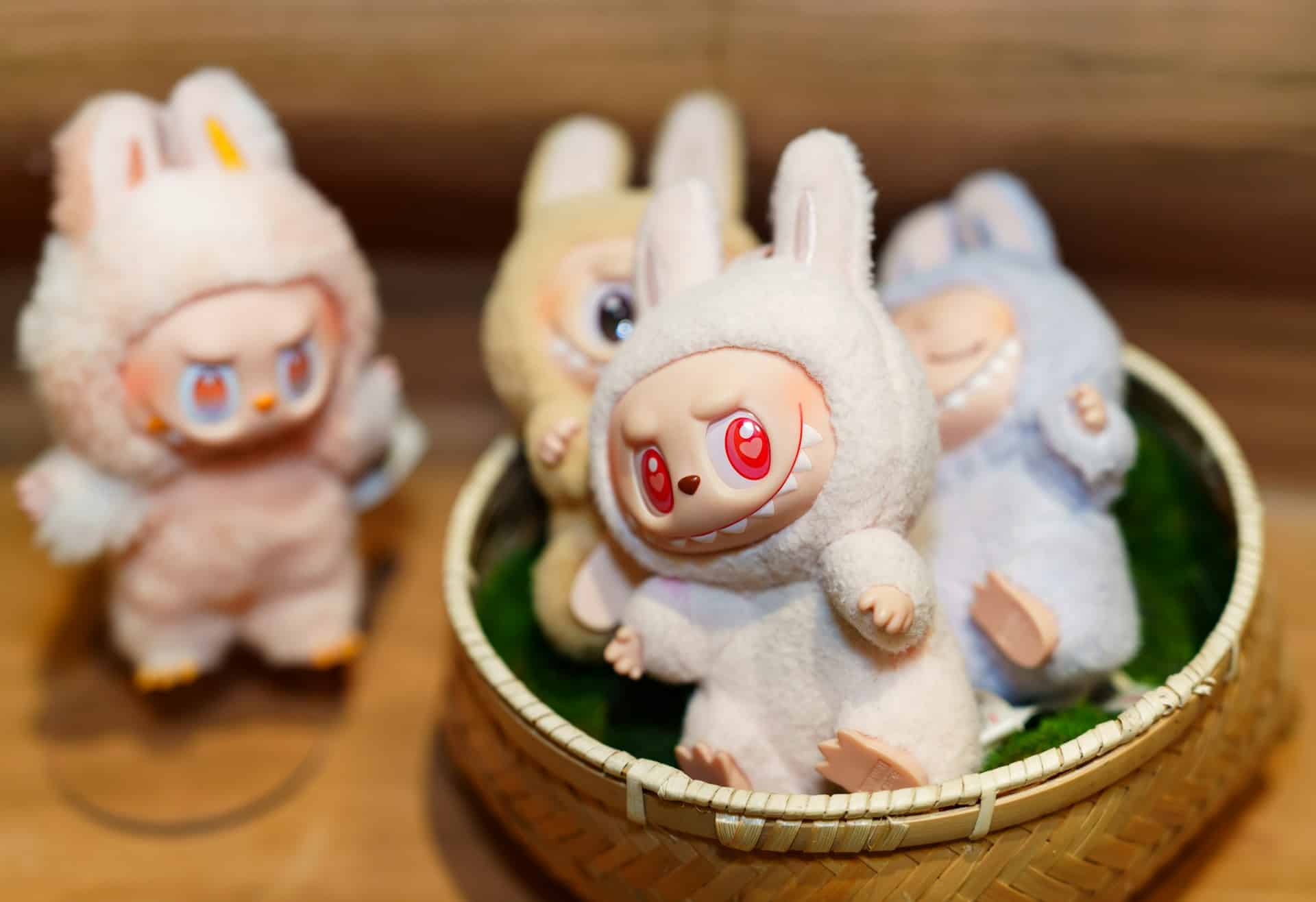 Four Labubu soft toys in a close-up photo